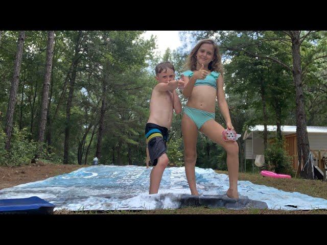 Gymnastics on the slip n’ slide with my brother and my sisters ￼