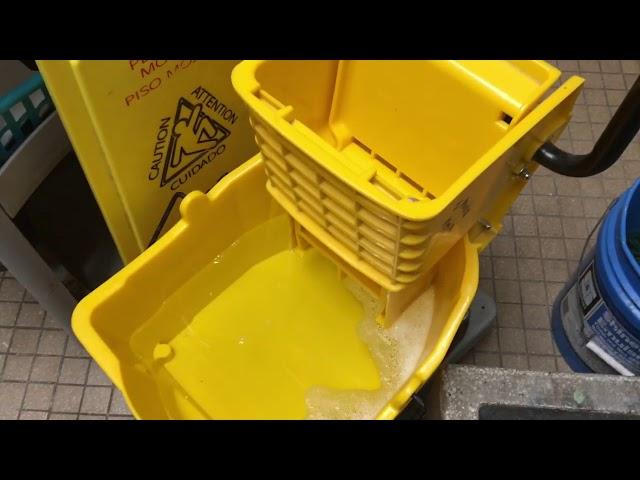 Janitor show how to help with mop bucket suds