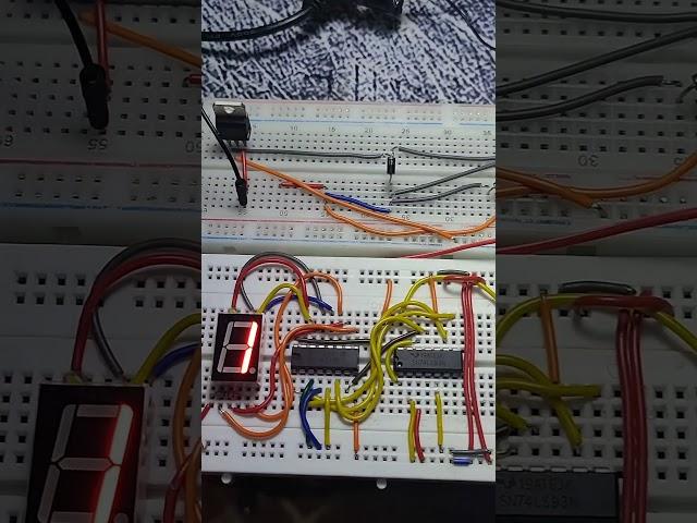 BCD-to-seven-segment decoder using 7447 IC , 7493 IC and 555 Timer IC