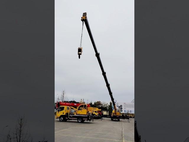 7-section boom crane. Guess how far the big brother can reach when the big boom is fully extended.