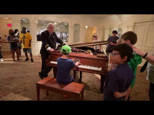 10 Year old plays piano for tourist at the Titanic Museum  @LoganRichPiano