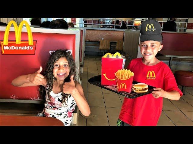 Kids pretend play working at McDonald's with surprise toys