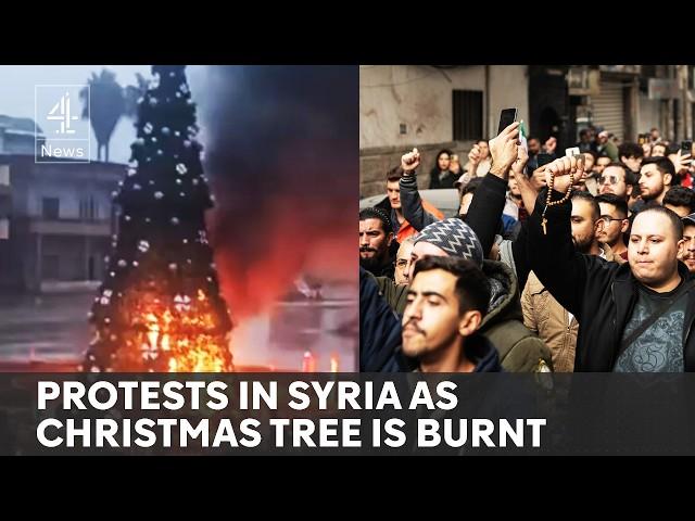 Hundreds protest in Syria after Christmas tree set alight