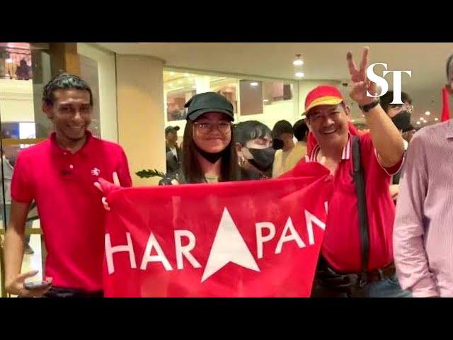 Anwar-led Pakatan Harapan supporters cheer as they await Malaysia GE15 results