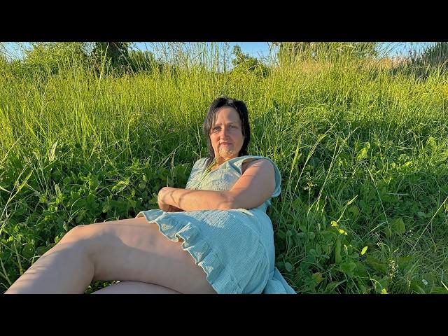 My wife tends the garden in a short dress. Evening work in the village