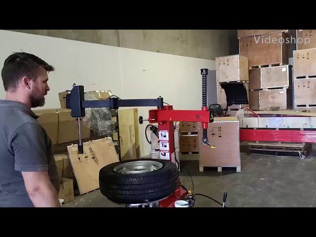 Demonstrating Bright LC810 tyre changer machine with assist arm