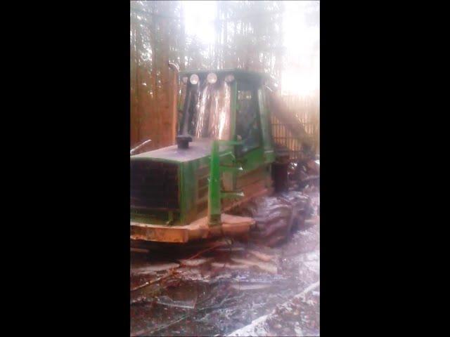 John Deere 1110 in wet forest, extreme conditions