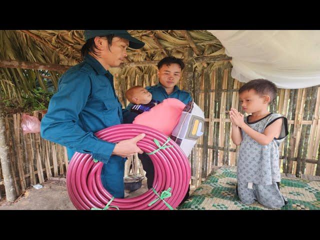 Border guards and commune militia helped the orphan boy lead the water pipe to the farm