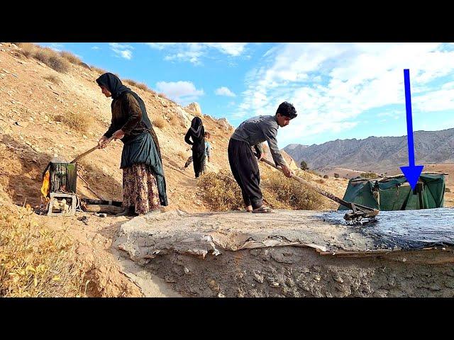 Placing the roof of the cave with tar by grandmother and Hossein to prevent the penetration of rain.