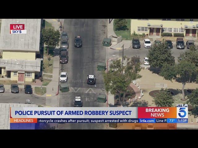 LAPD pursues fleeing armed robbery suspect in Los Angeles