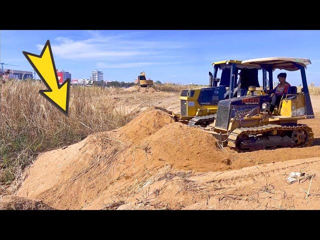 The Powers Machine Two bulldozer Big & Small Pushing the sand together