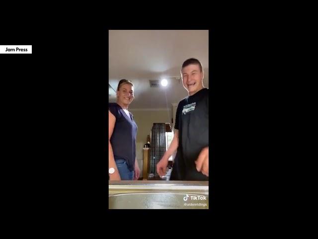 son slaps moms boobs