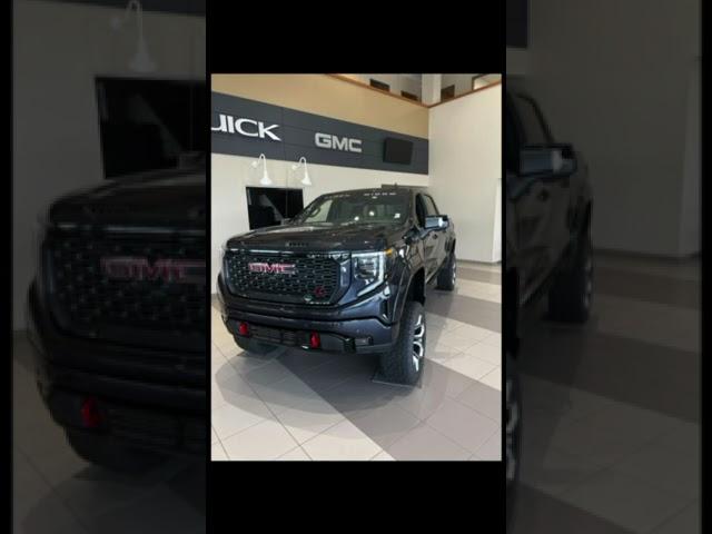 Ty the Car Guy displaying a GMC Sierra 6.2L Black Widow Conversion Truck