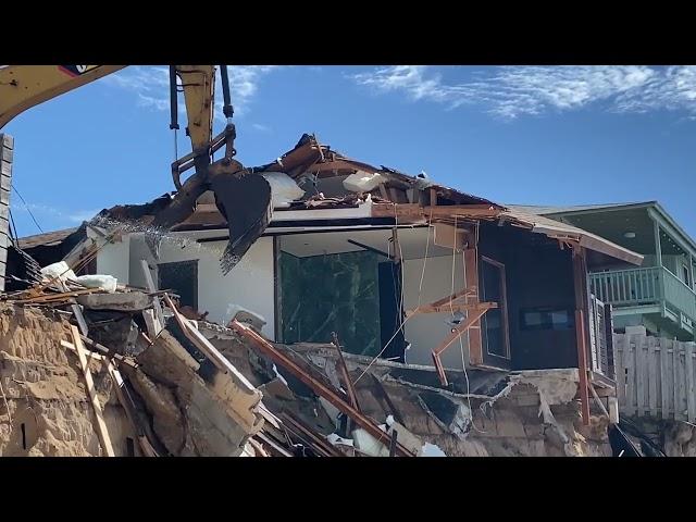 Demolition begins on eroded North Shore home