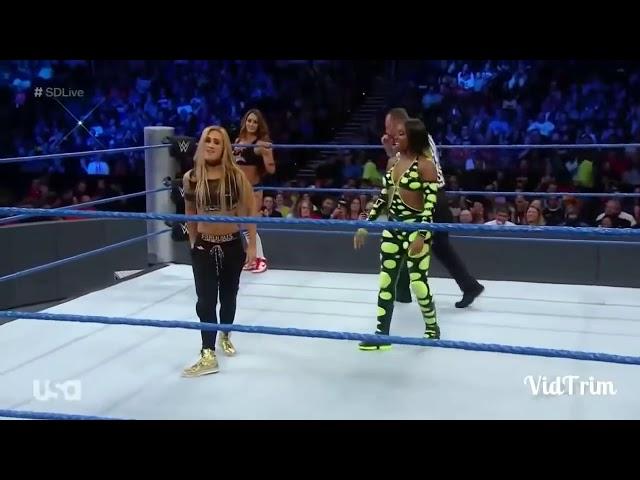 Naomi spanks and corner stinkface Carmella