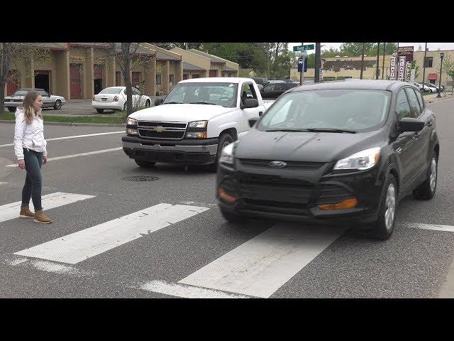 Never Pass Vehicles Stopped at a Crosswalk