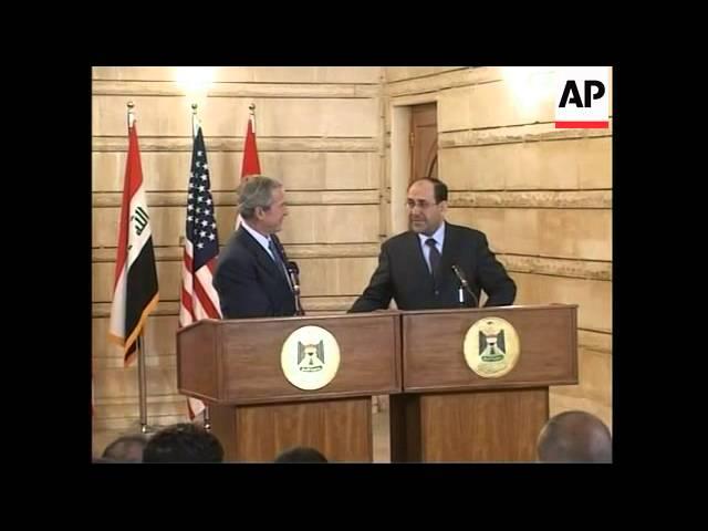 President Bush ducks as man throws shoes during news conference