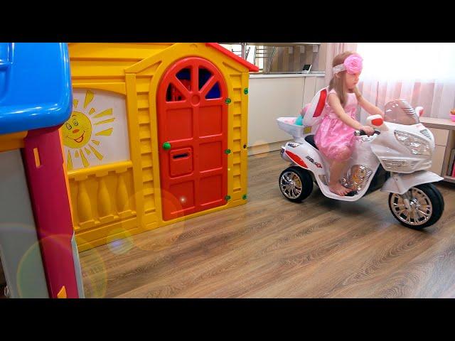 Eva playing with funny playhouses toys