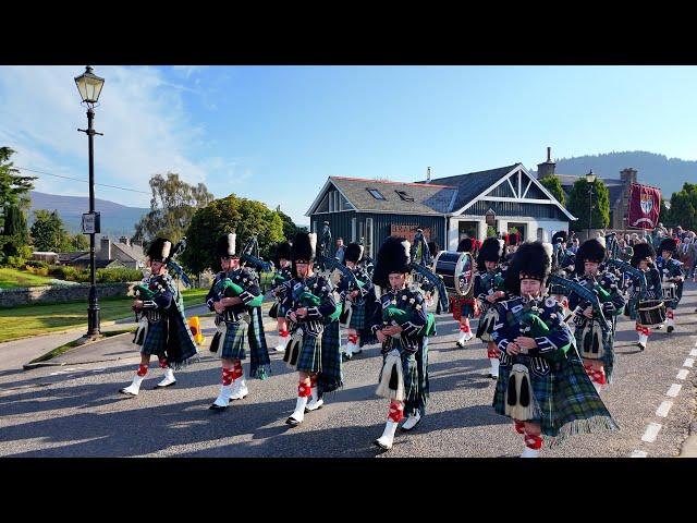 Pipe Band lead the Braemar Royal Highland Society on the march to 2024 Braemar Gathering in Scotland