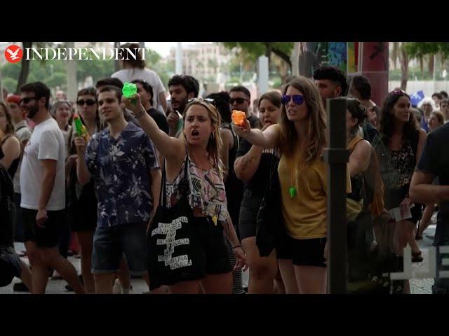 Spanish protesters squirt water at Barcelona tourists: ‘Go home’