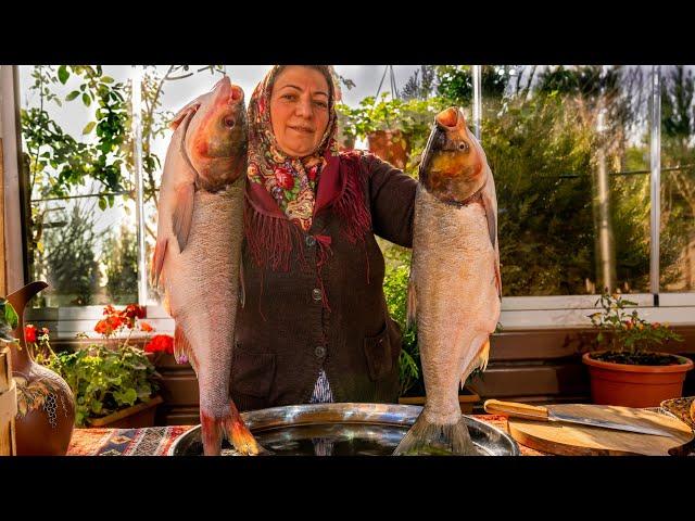 Big Fish Fried on a Stone. Grilled Fish and Samovar Tea