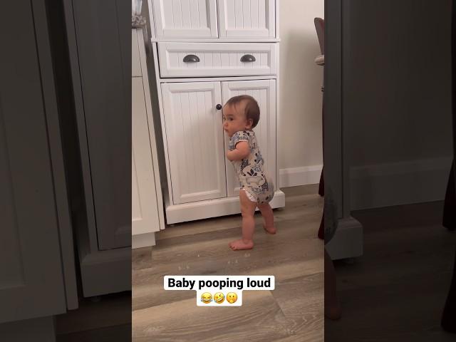 Baby pooping in the corner 