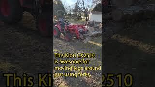 Kioti CX2510 moving logs with fork attachment
