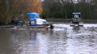 Two Truxor amphibious machines excavating silt behind Nicospan fence with Clamshell (1)