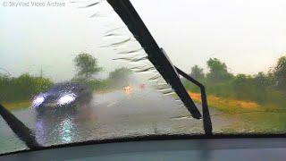 Heavy rain on the road, driving a car on the highway. Extreme weather