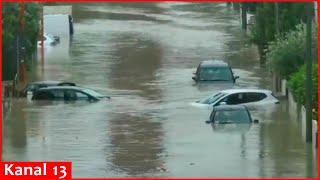 Water flows down the street, as floods hit Italy's northern Emilia-Romagna region