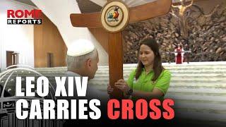 Pope Leo XIV carries the Jubilee cross and leads pilgrimage to the Holy Door
