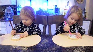 Twins decorate cookies