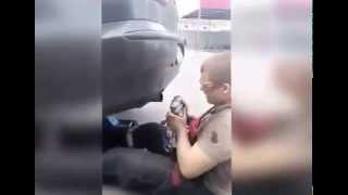 Crazy russian mechanic puts his face in car exhaust