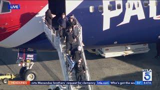 Dodgers land at LAX, return as World Series champs