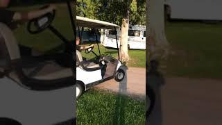 Popping a wheelie on the golf cart