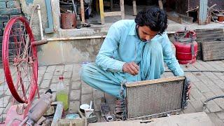 This young mechanic is brilliant in radiator repairing