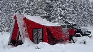 OUR TENT WAS COVERED IN SNOW DURING THE SNOWSTORM