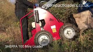 Sherpa Mini Loader muscles log up steep muddy slope