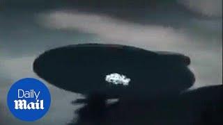 Bizarre footage from Malaysia shows giant UFO hovering - Daily Mail