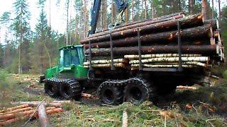 John Deere 1110D logging in wet forest, big load