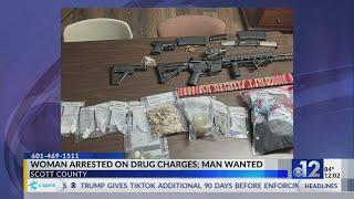 Woman arrested, man sought in Scott County drug trafficking case