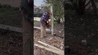 Using a chainsaw on wood fence