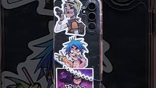 I got a new phone case and out stickers and a charm in it 