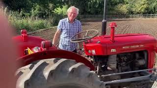 Working land and planting crops with vintage tractors