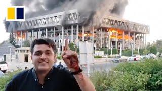 Watch moment Iran state TV live broadcast interrupted by Israeli air strike