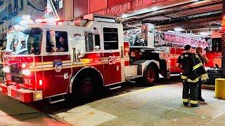 FDNY LADDER 20 RETURNING TO QUARTERS ON LAFAYETTE STREET IN SOHO AREA OF MANHATTAN IN NEW YORK CITY.