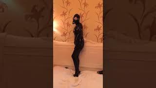 Latex catsuit and gasmask