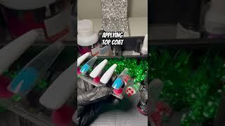 Applying top coat. #applying #topcoat #coating #nails