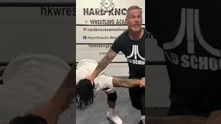 Pro wrestling catch wrestling working for cross arm submission