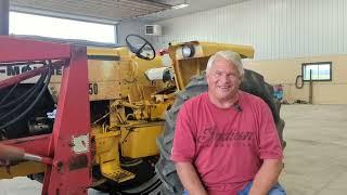 An Oliver in prairie gold clothes. Pulling an 8 row planter. The celebrity Minnie Mo